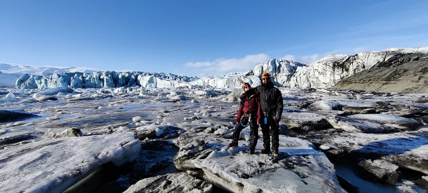 Nick and his wife Sonja on a frozen landscape in front of a glacier